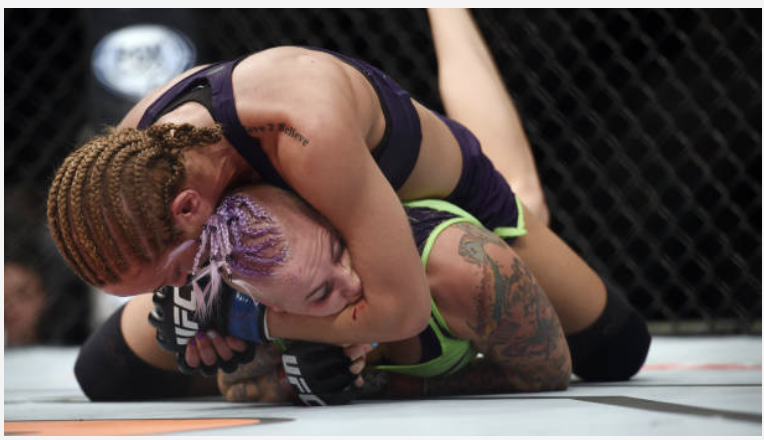 Heather Jo Clark grappling during a UFC bout